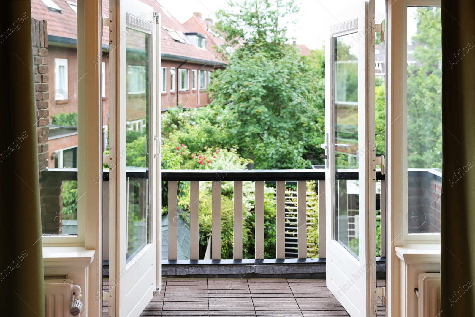 Photo of Beautiful view on balcony and inner yard with green trees from apartment