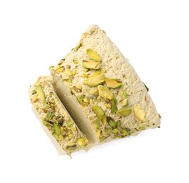 Photo of Tasty halva with pistachios isolated on white, top view