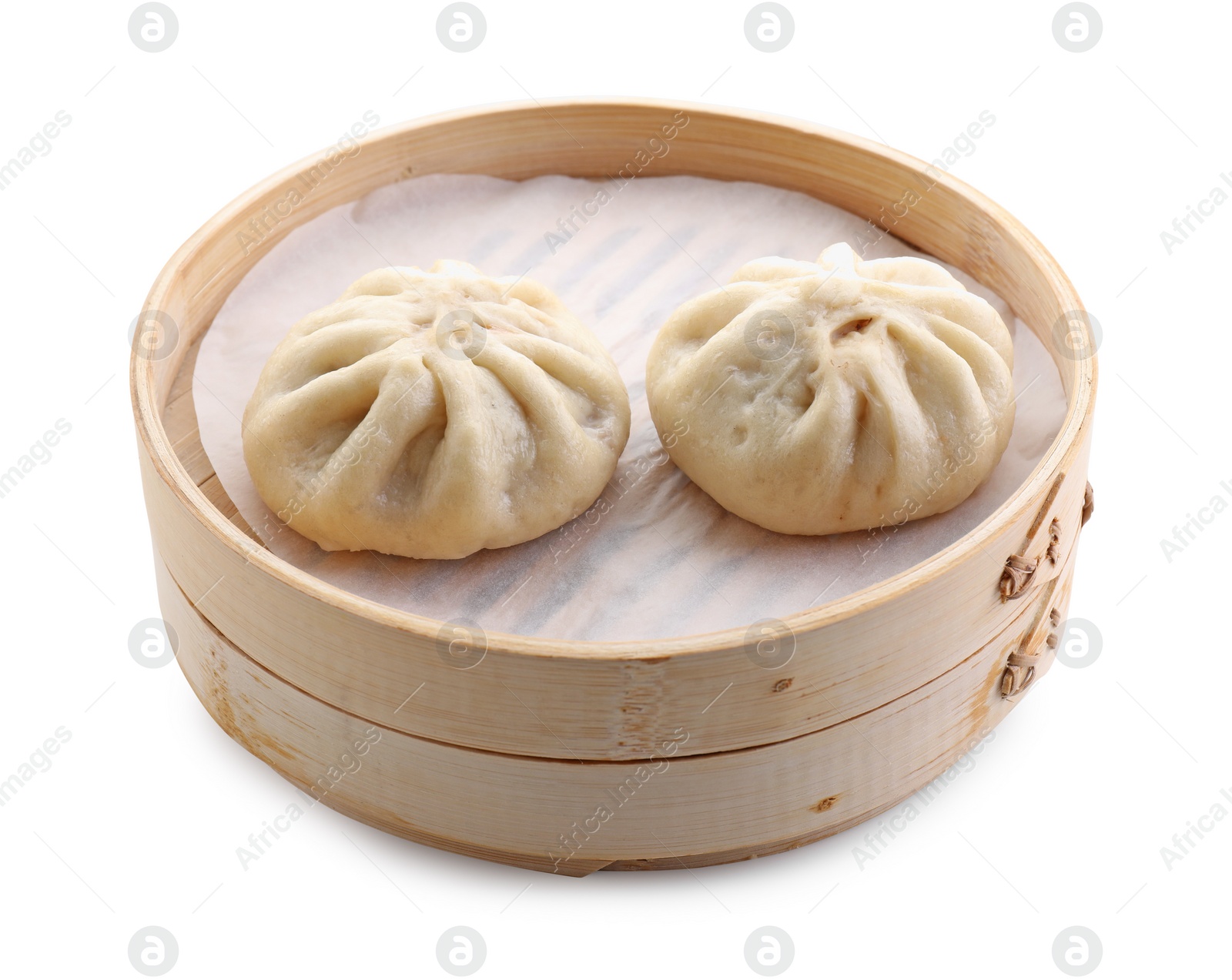 Photo of Delicious bao buns (baozi) in bamboo steamer isolated on white