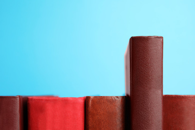 Photo of Collection of old books on light blue background