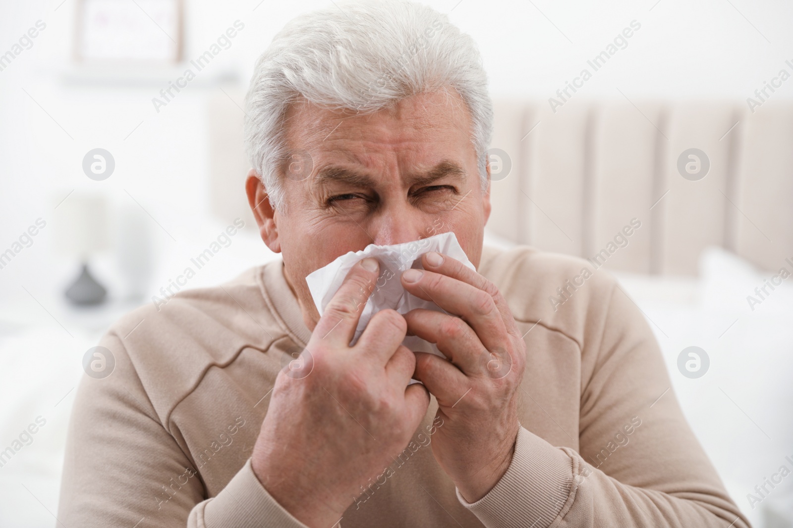 Photo of Mature suffering from cold at home. Dangerous virus