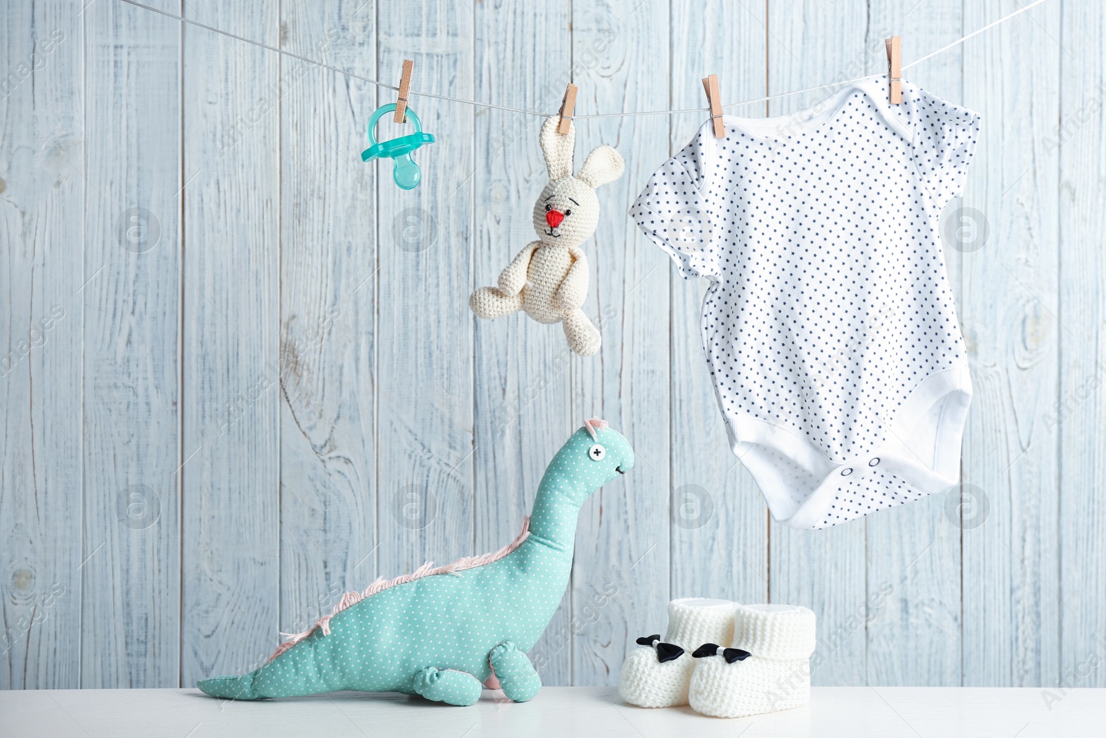 Photo of Composition with baby accessories on wooden background