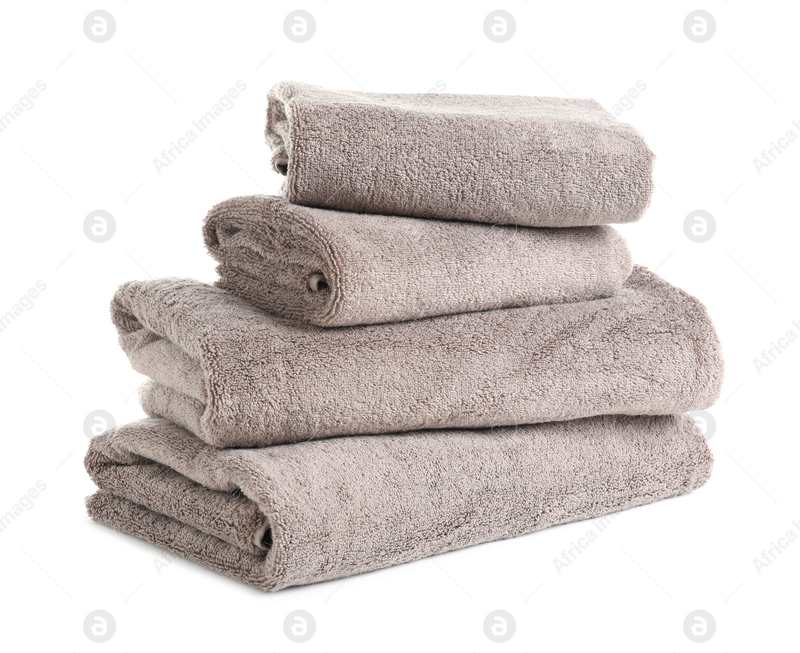 Photo of Stack of fresh towels isolated on white