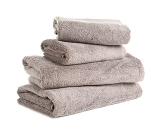 Photo of Stack of fresh towels isolated on white