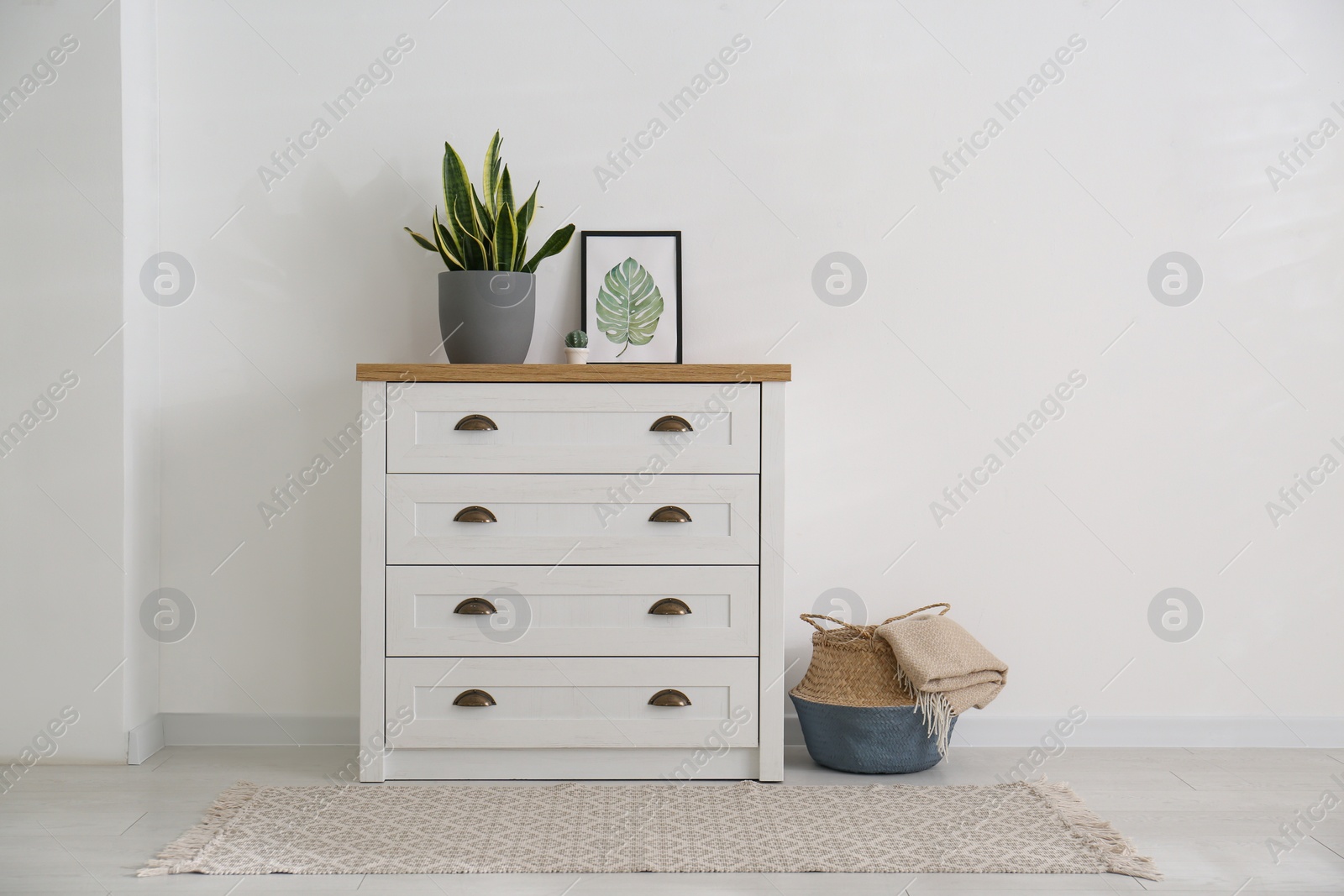 Photo of Stylish chest of drawers in living room interior