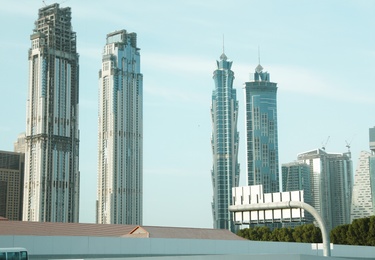 Photo of DUBAI, UNITED ARAB EMIRATES - NOVEMBER 03, 2018: Landscape with luxury hotels on sunny day