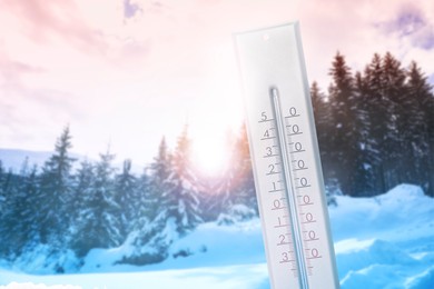 Image of Thermometer showing temperature below zero outdoors on winter day