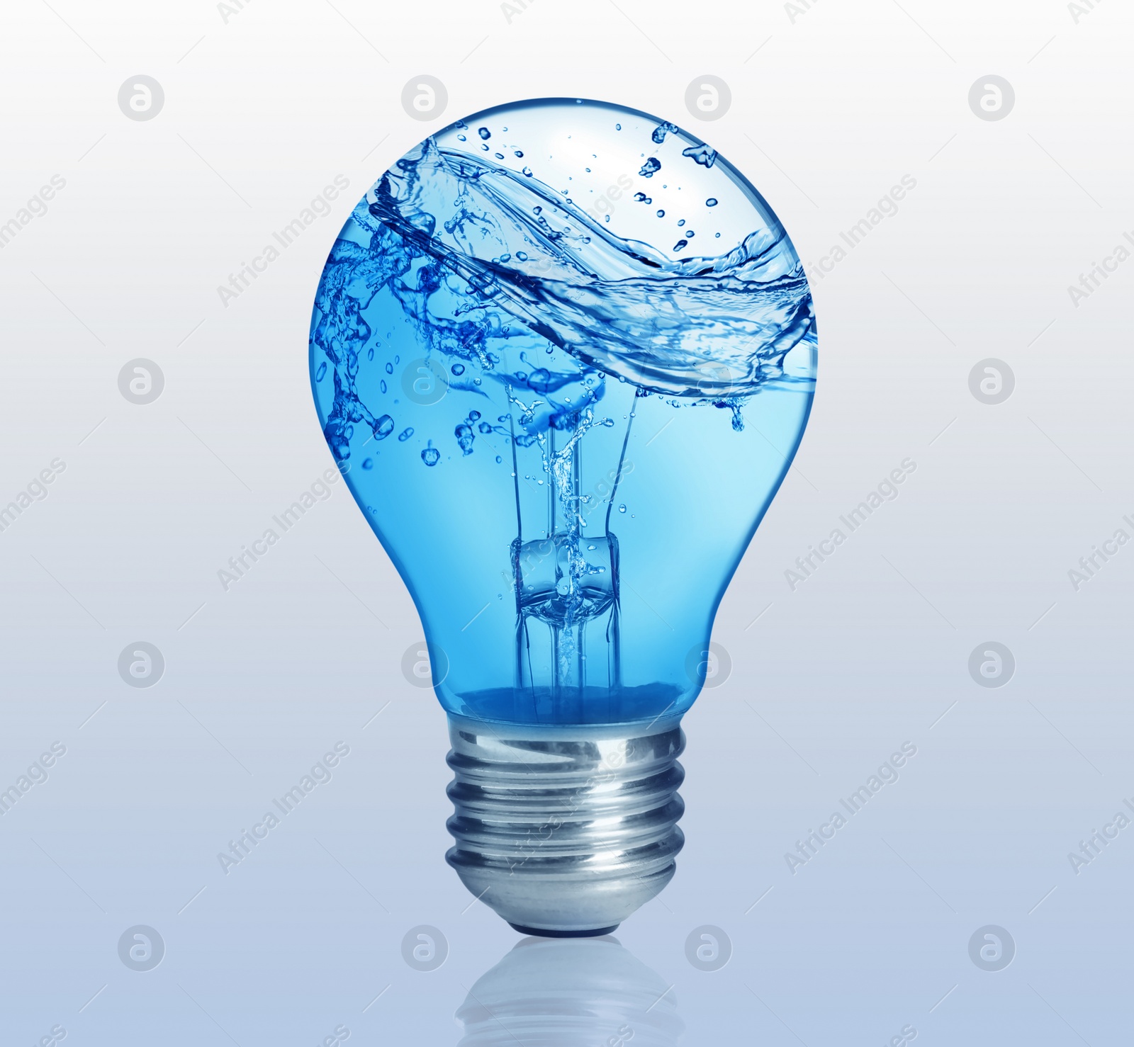 Image of Light bulb with water splashes on light background. Alternative energy source