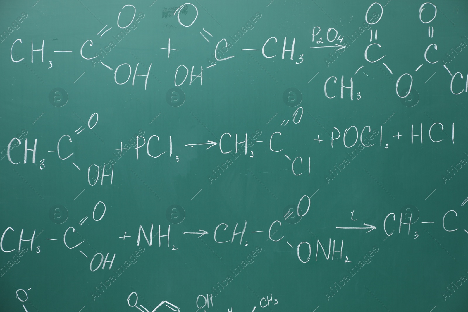 Photo of Chemical formulas written with chalk on green board