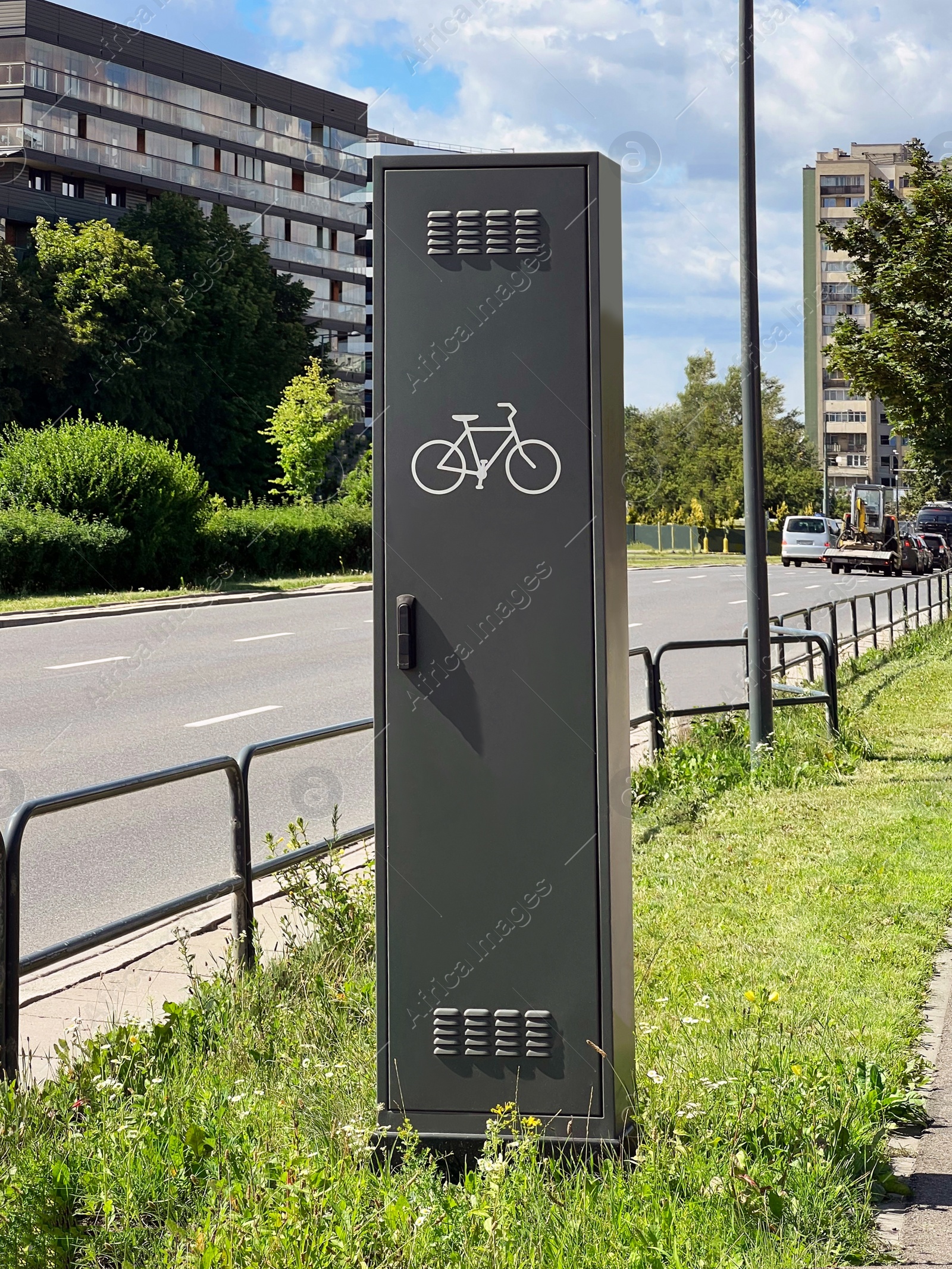 Photo of Public bicycle repair station near road in city