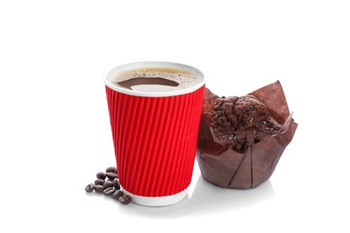 Aromatic coffee in takeaway paper cup with beans and tasty muffin on white background