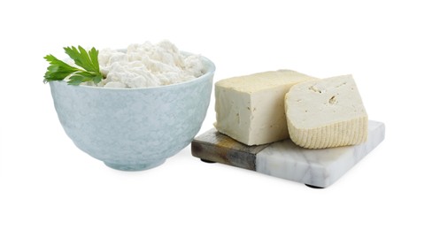 Different types of delicious tofu cheese with parsley on white background