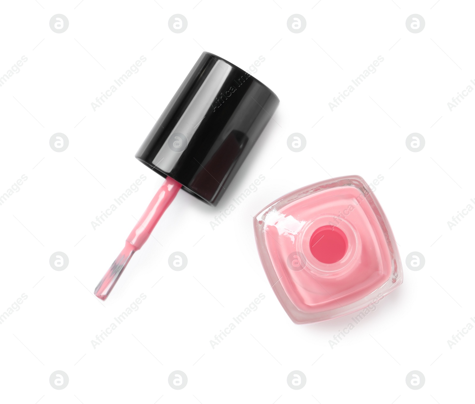 Photo of Bottle of color nail polish with brush on white background, top view