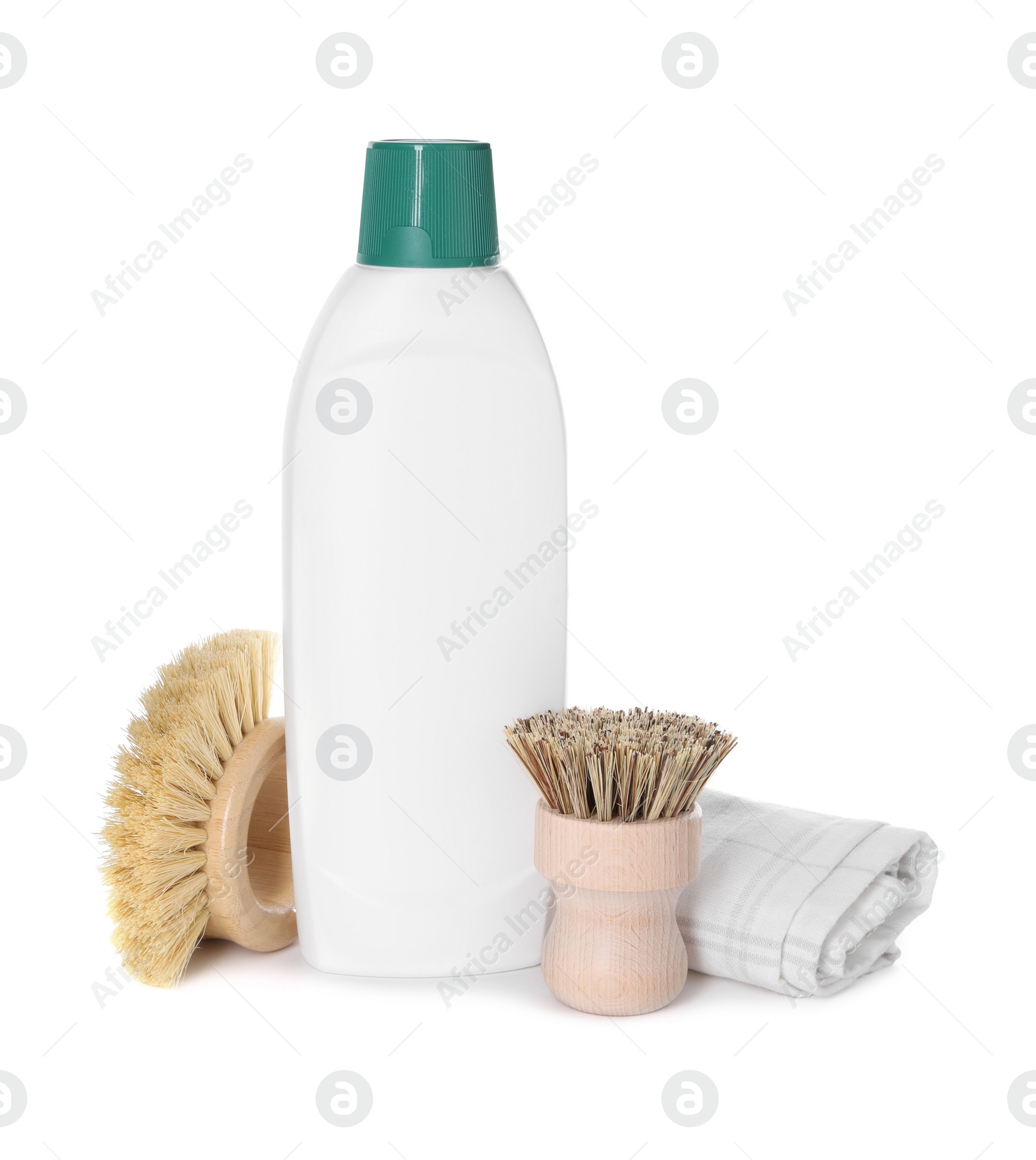 Photo of Bottle of cleaning product, rag and brushes isolated on white