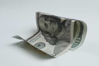 Photo of Money exchange. Dollar banknote on white background, closeup