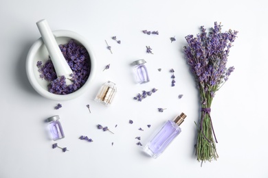Photo of Composition with lavender flowers and natural cosmetic on white background, top view