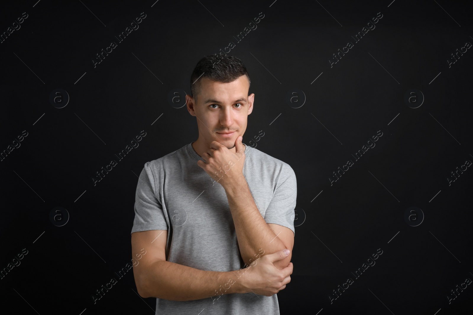 Photo of Portrait of handsome man on black background