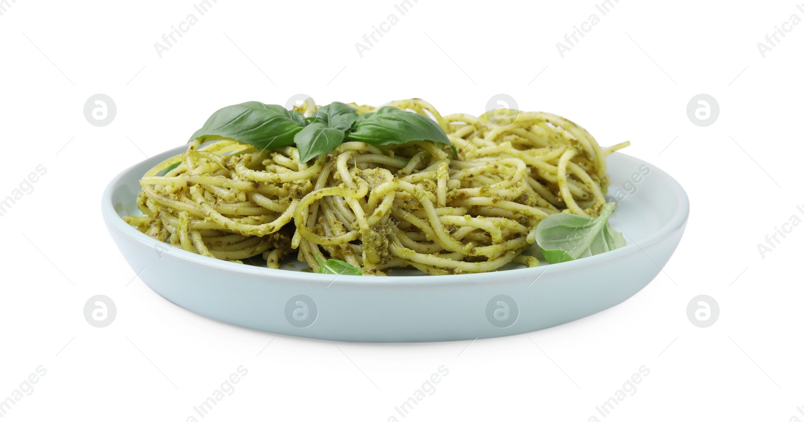 Photo of Plate of delicious pasta with pesto sauce and basil isolated on white