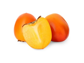 Photo of Whole and cut delicious ripe juicy persimmons on white background