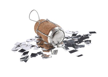 Photo of Cork of sparkling wine with muselet cap and shiny silver confetti on white background