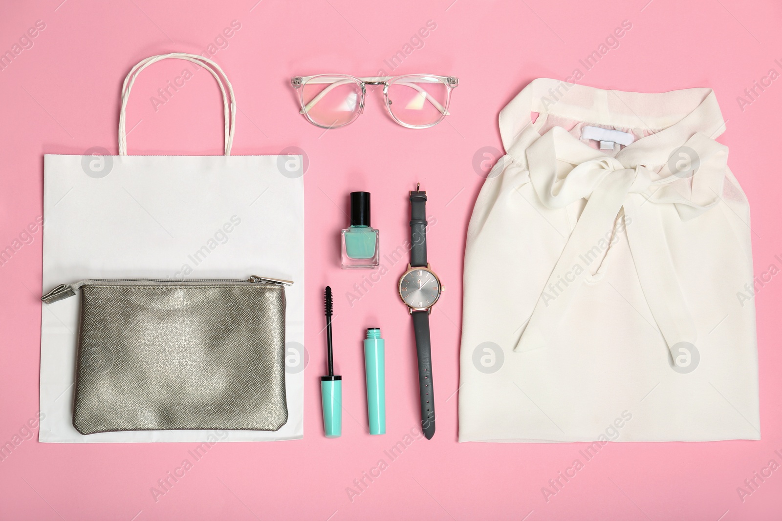 Photo of Stylish flat lay composition with shopping bag on color background