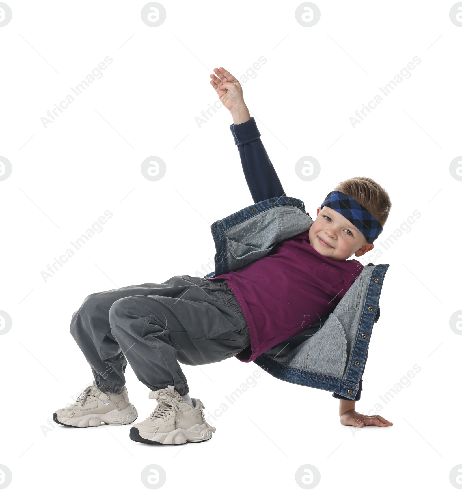 Photo of Happy little boy dancing on white background