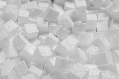 Photo of Pile of styrofoam cubes as background, closeup