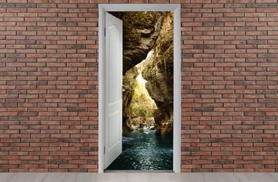 Image of Beautiful clean river and cliffs visible through open door