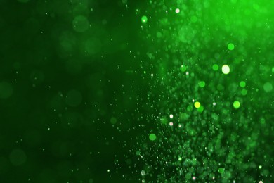 Image of St. Patrick day. Shiny glitter on green background, bokeh effect