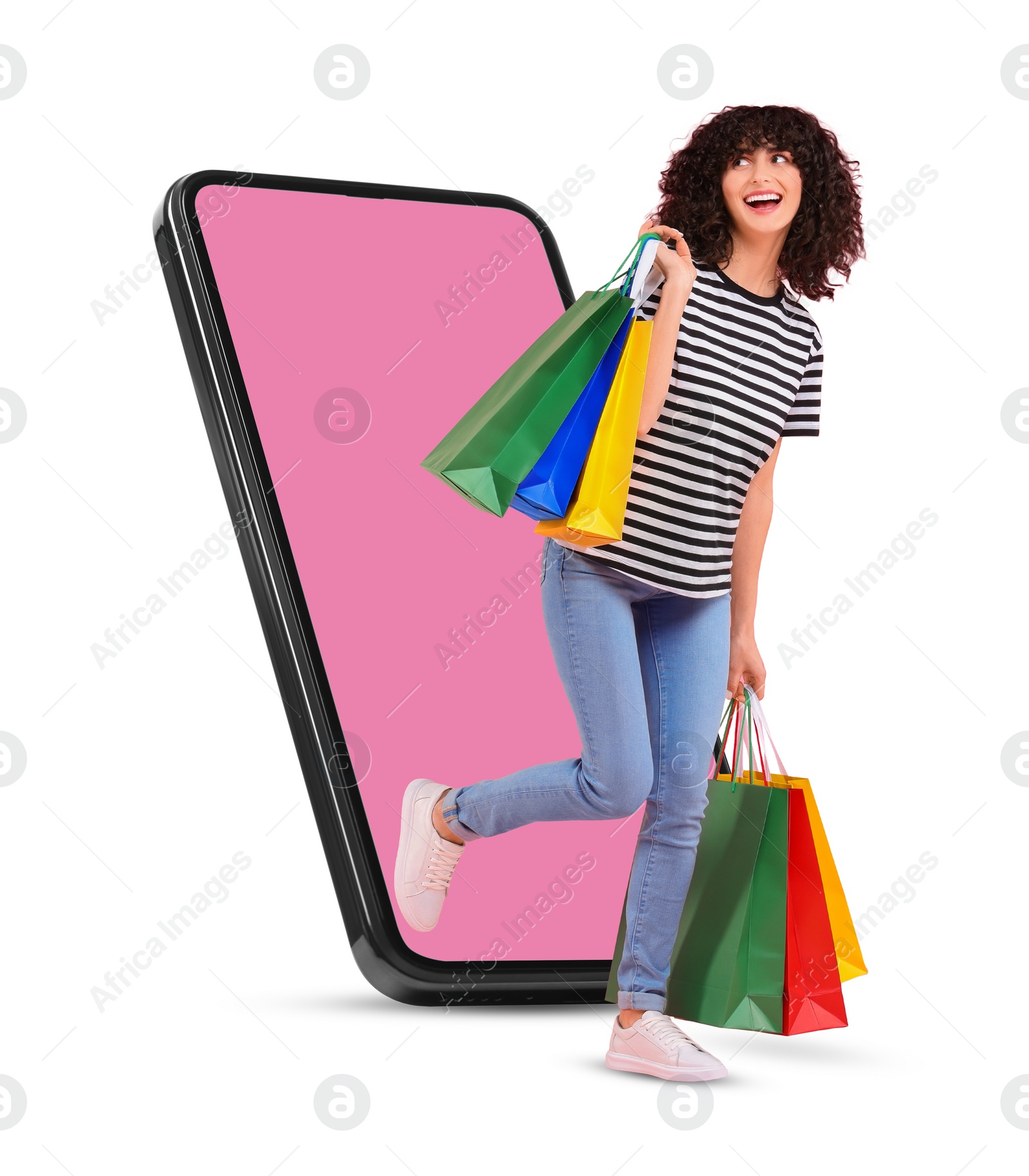 Image of Online shopping. Happy woman with paper bags walking out from smartphone on white background