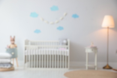 Blurred view of stylish baby room interior