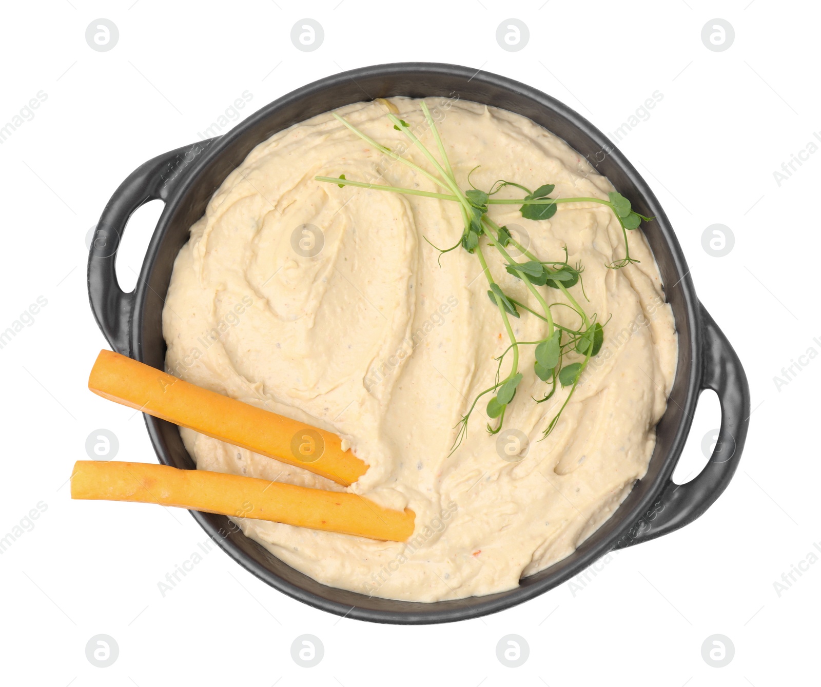 Photo of Delicious hummus with grissini sticks on white background, top view