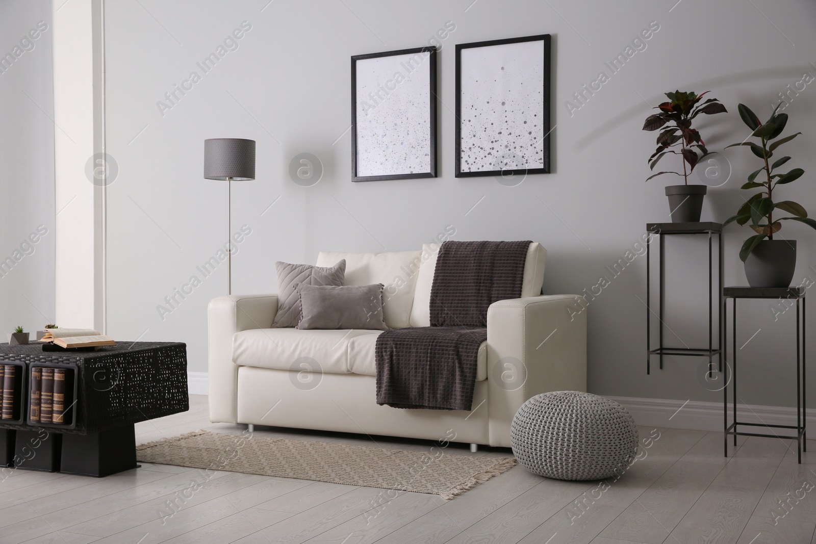 Photo of Modern comfortable sofa in stylish living room interior