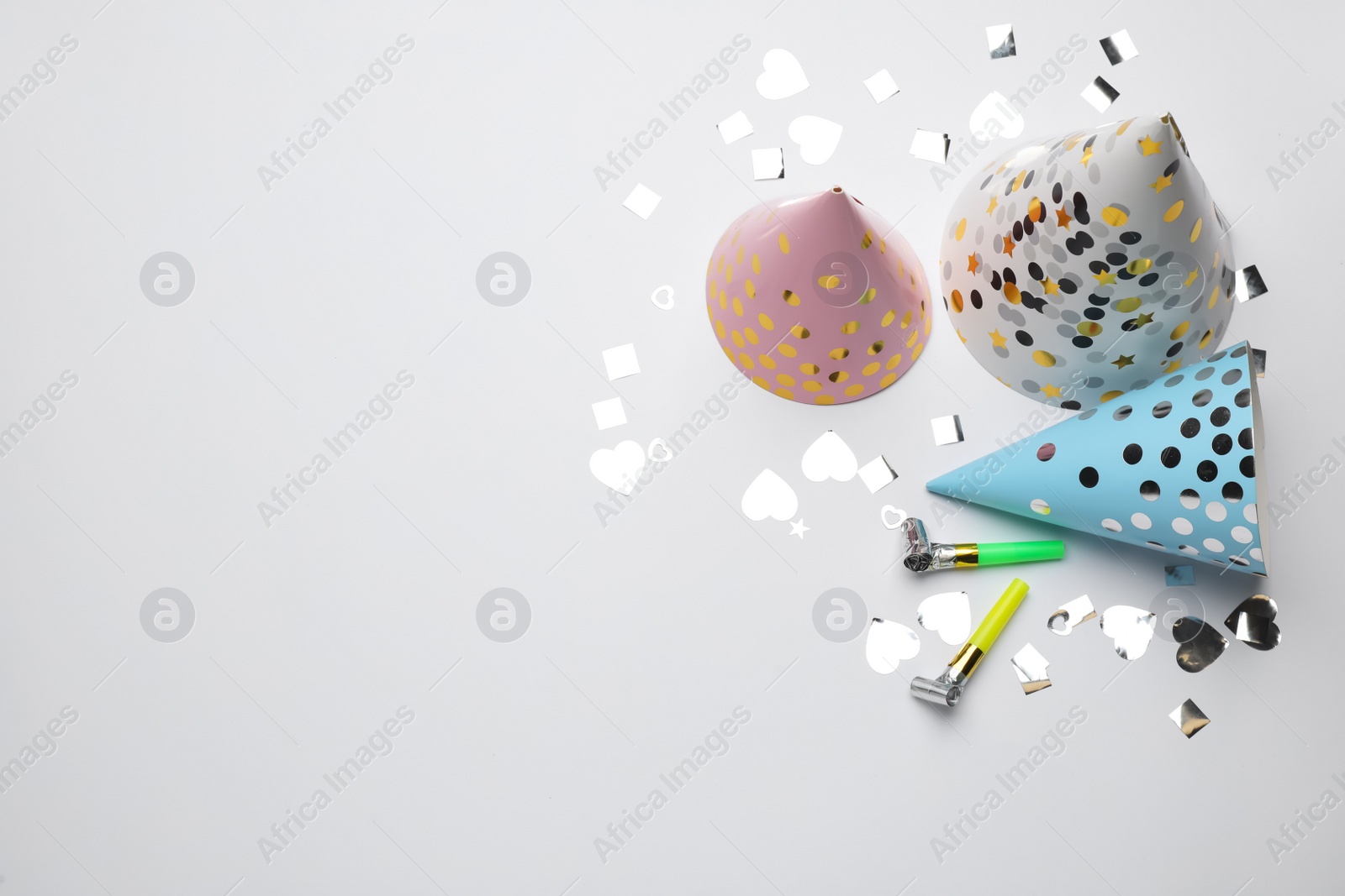 Photo of Flat lay composition with party items on white background, space for text