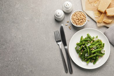 Tasty salad with green beans served on light grey table, flat lay. Space for text