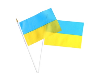 Photo of National flags of Ukraine isolated on white, top view