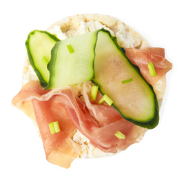 Photo of Puffed rice cake with prosciutto and cucumber isolated on white, top view