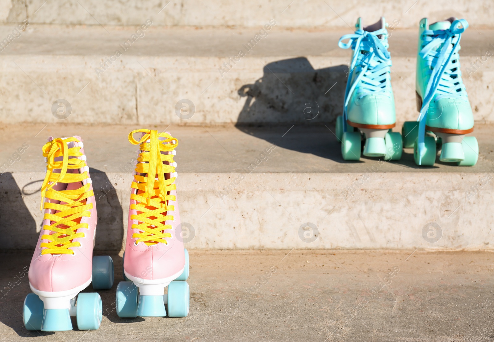 Photo of Vintage roller skates on stone stairs outdoors