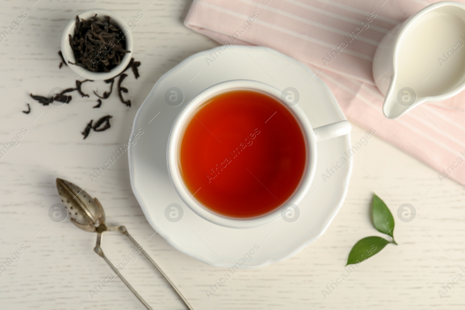 Photo of Flat lay composition with delicious tea on wooden background