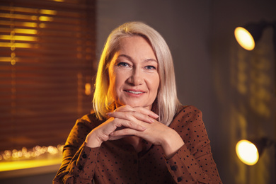 Photo of Portrait of beautiful mature woman at home