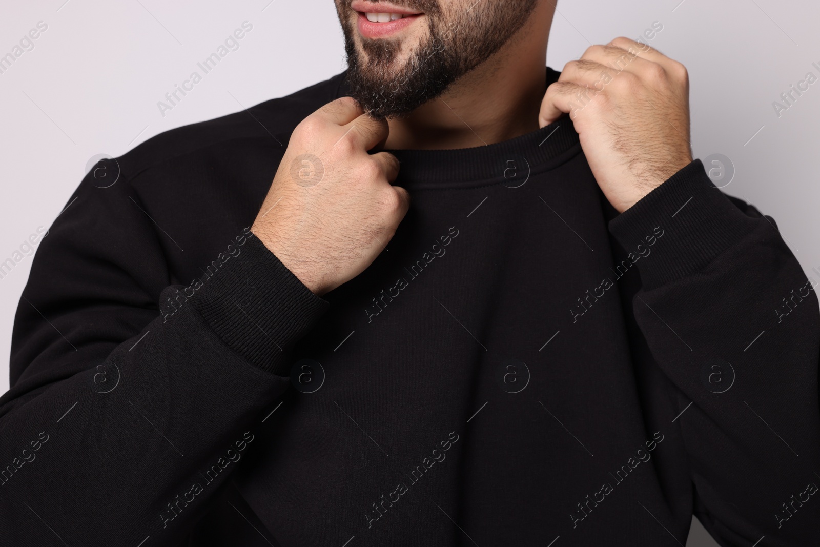 Photo of Man in stylish sweater on white background, closeup