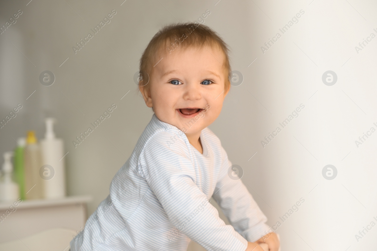 Photo of Cute little baby in crib at home