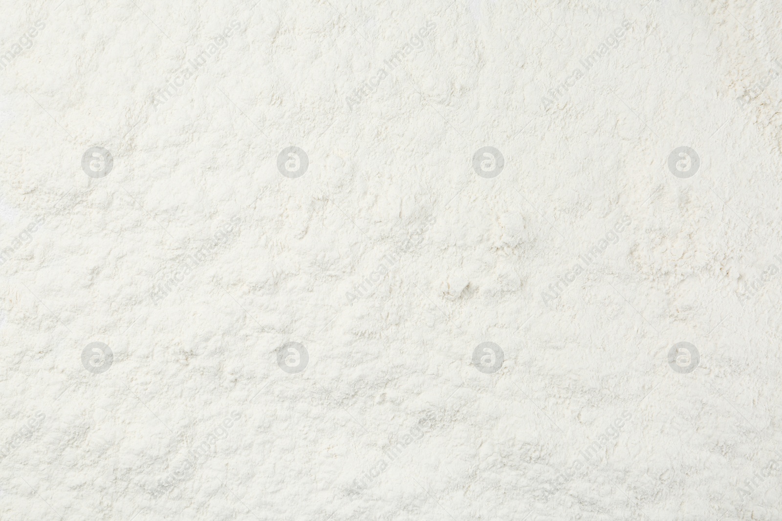 Photo of Pile of organic flour as background, top view