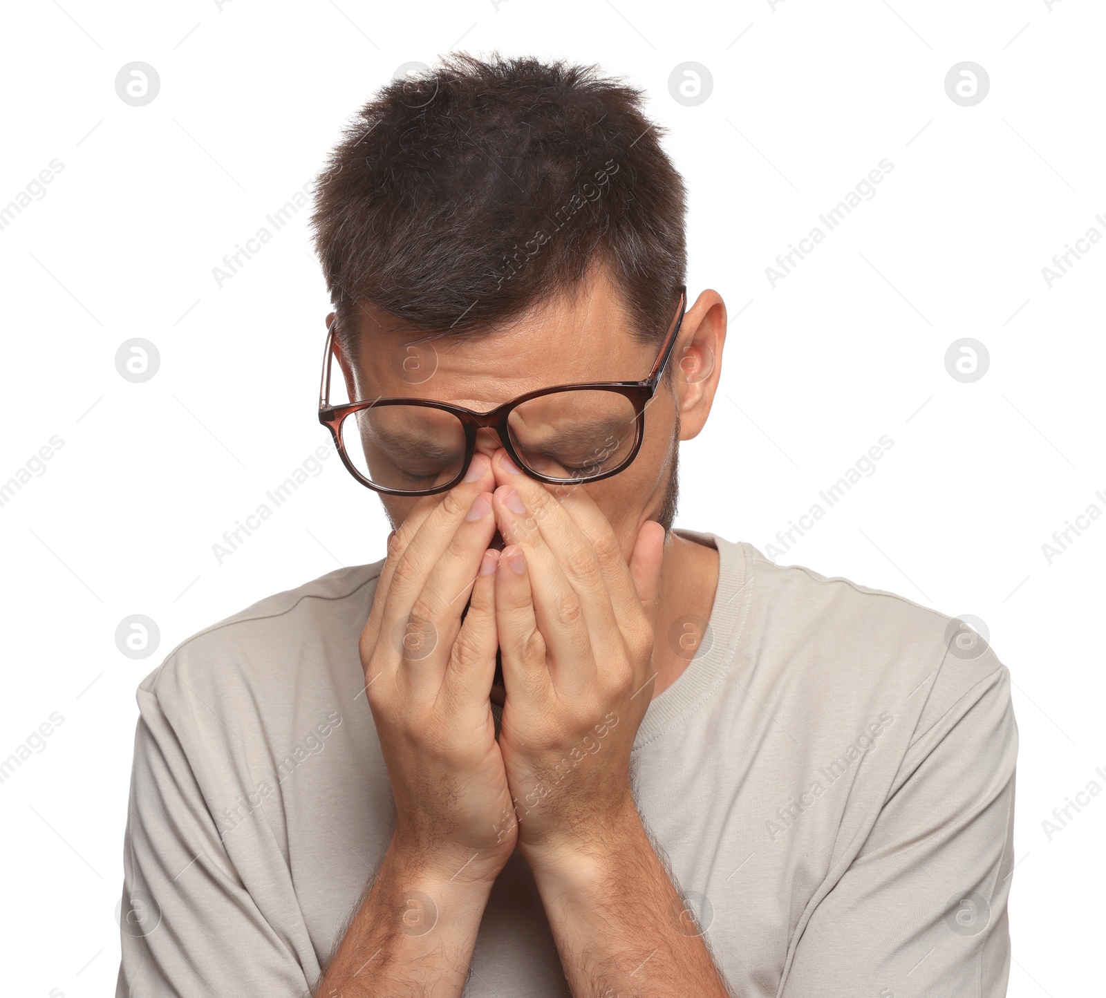 Photo of Man suffering from eyestrain on white background