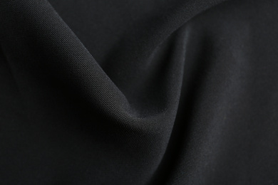 Photo of Texture of beautiful black fabric as background, closeup
