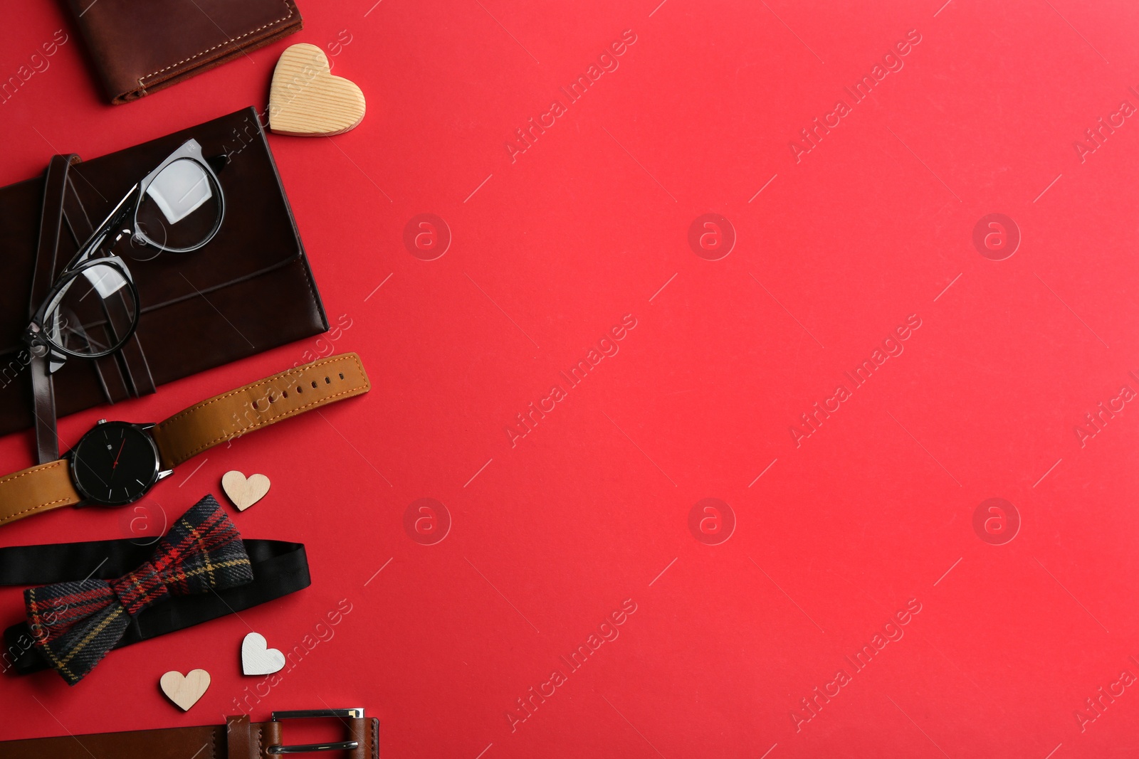 Photo of Flat lay composition male accessories on red background, space for text. Happy Father's day