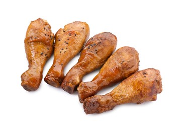 Photo of Chicken legs glazed with soy sauce isolated on white