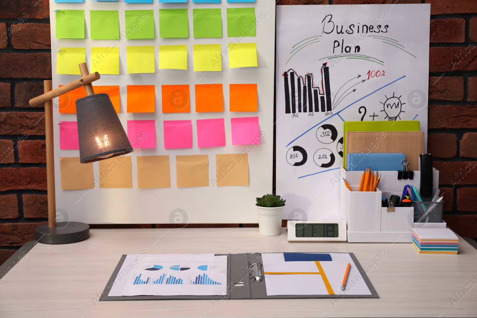 Photo of Business process planning and optimization. Workplace with colorful paper notes and other stationery on table