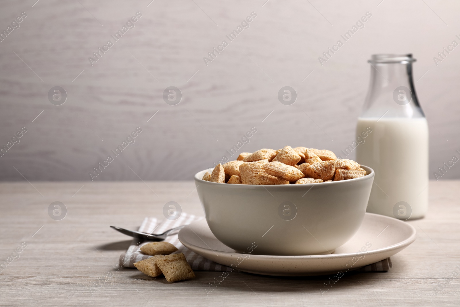 Photo of Delicious corn pads served on light wooden table. Space for text