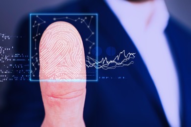 Man using biometric fingerprint scanner, closeup view 